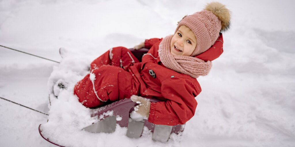 child playing in snow